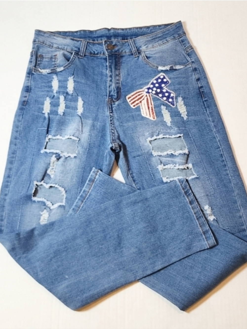 Stylish Blue Boyfriend Jeans with Bow Accents